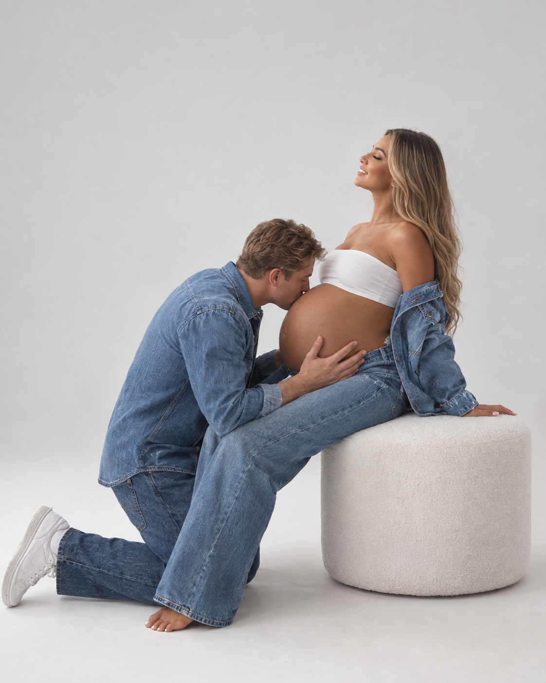 Partner kneeling to kiss the baby bump during a denim styled Toronto maternity session